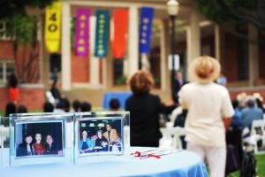 The ceremony was draped with banners, and framed photos as centerpieces.